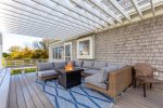 Outdoor area off the back deck featuring outdoor sofa and fire pit